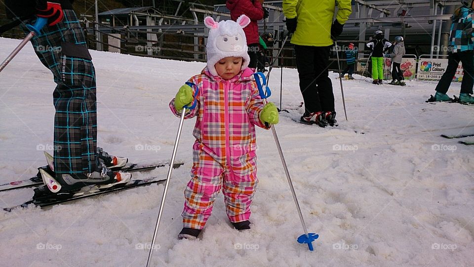Girl playing on snow
