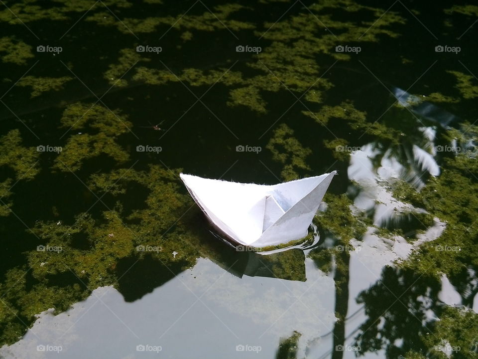 playing with paper boat