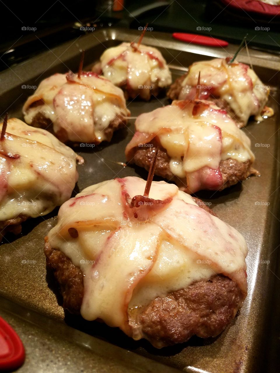 Bacon wrapped burgers with pineapple and BBQ sauce. Baked!