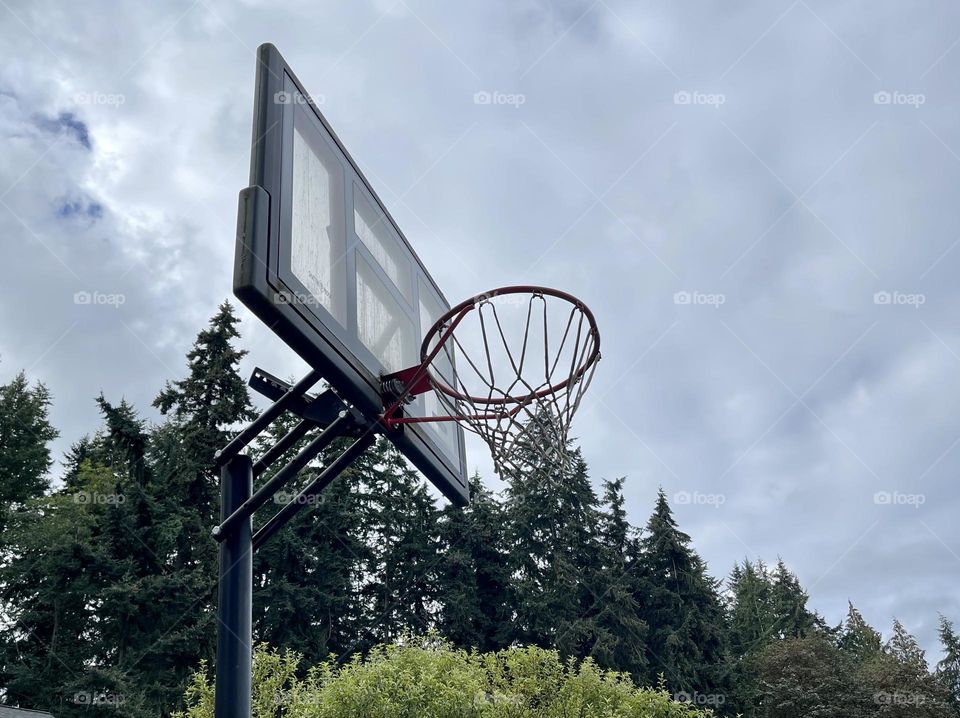 Basketball hoop outside on the sky background 