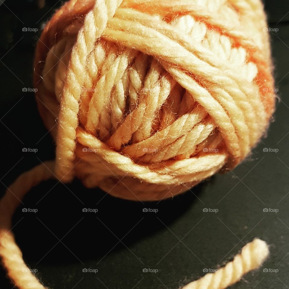 Ball of orange yarn