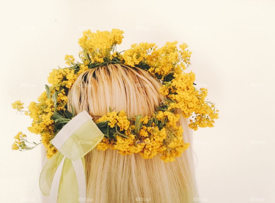 crown from spring flowers on blond hair