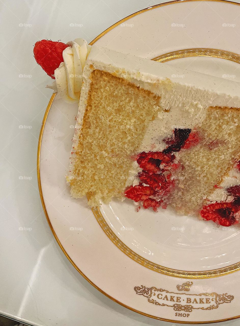 Delicious cake on a plate, have your cake and eat it too, raspberry vanilla champagne cake, eating cake for the holidays, eating at the cake bake shop