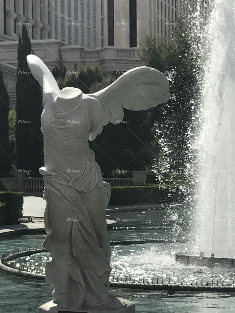 This is a statue standing in a water fountain in Las Vegas. I captured this photo while walking down the strip. 