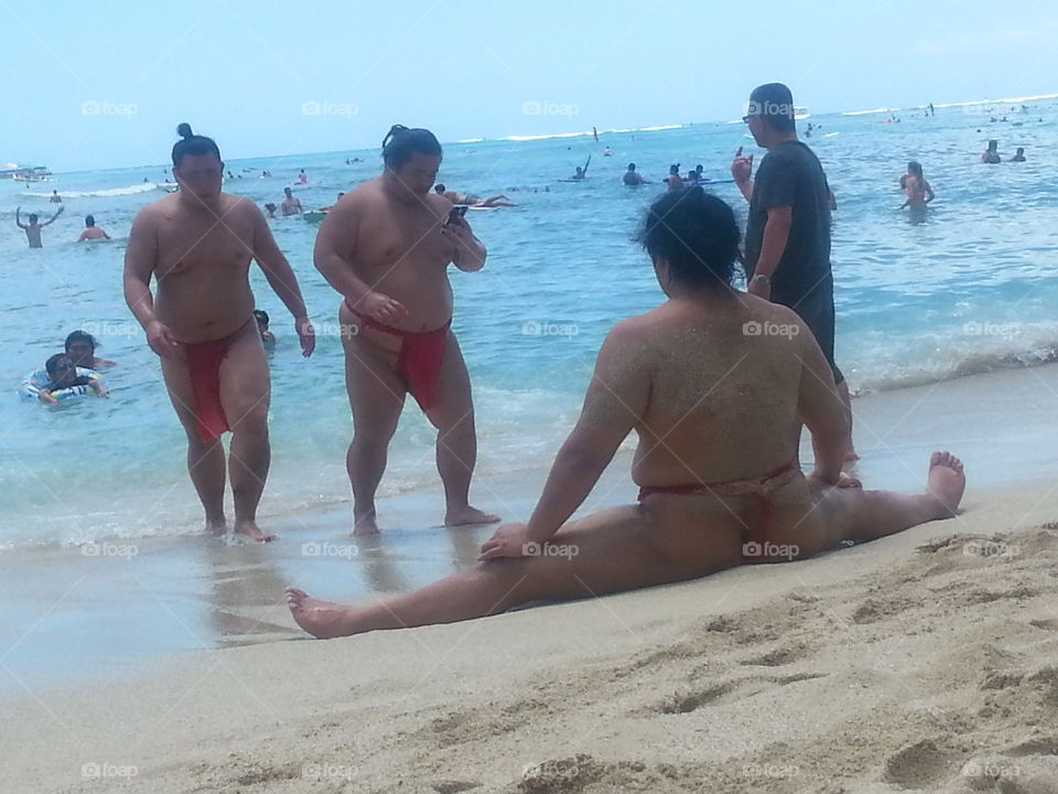 Sumo Fun in the sun. What kind and lovely sumo wrestlers enjoying Waikiki beach and providing me with a little entertainment