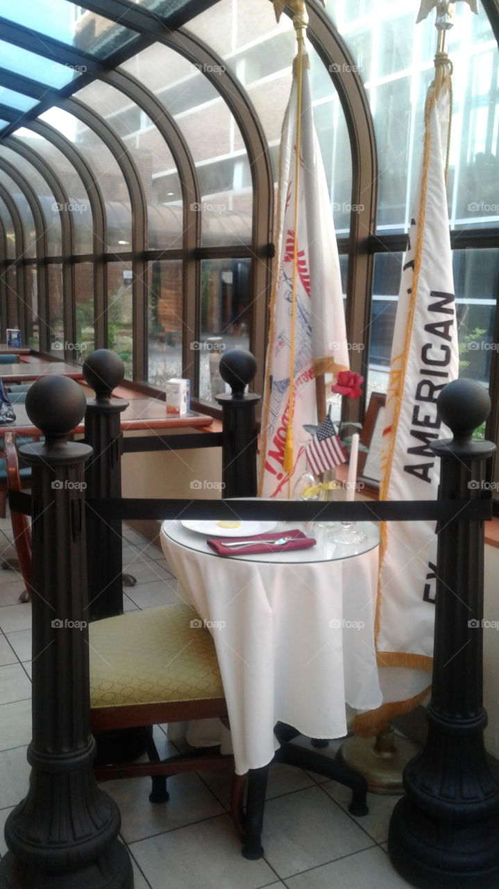 Reserved place setting. tribute honoring POW/ MIA
