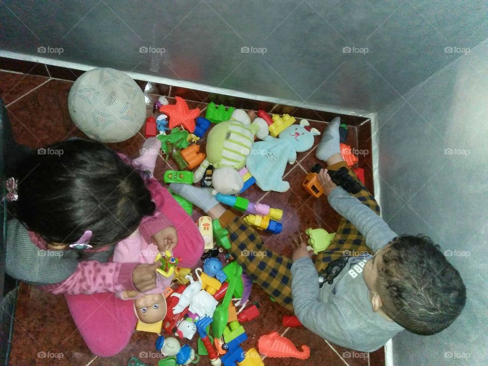 The kids  play with toys