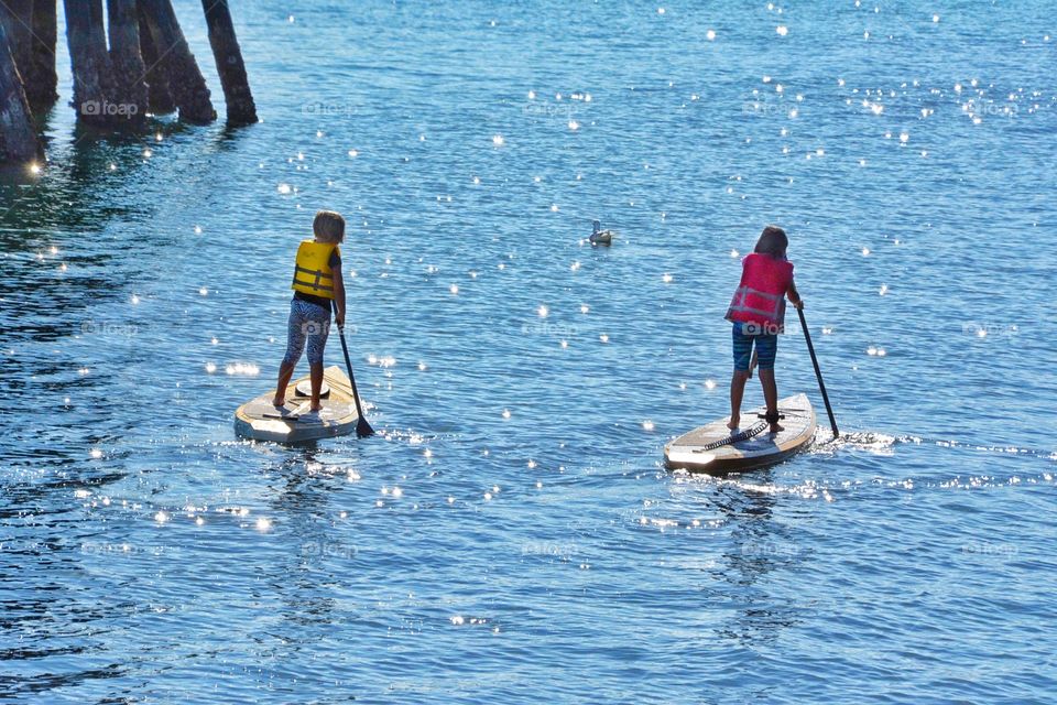 Girls paddle boarding 