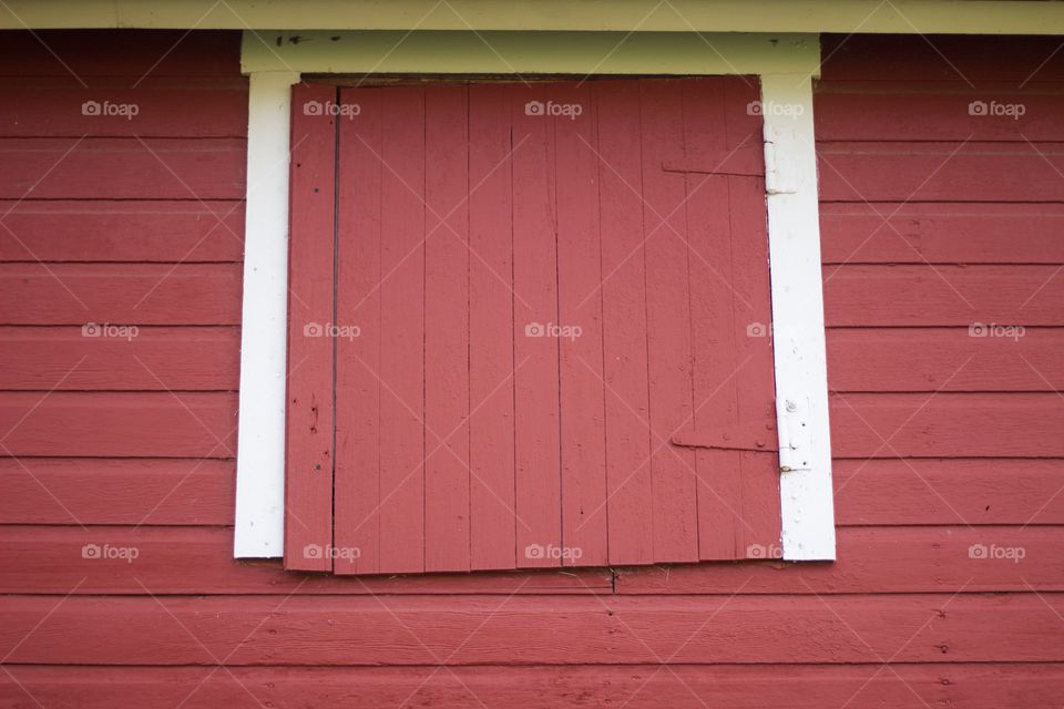 Isolated view of hay loft door on a red barn