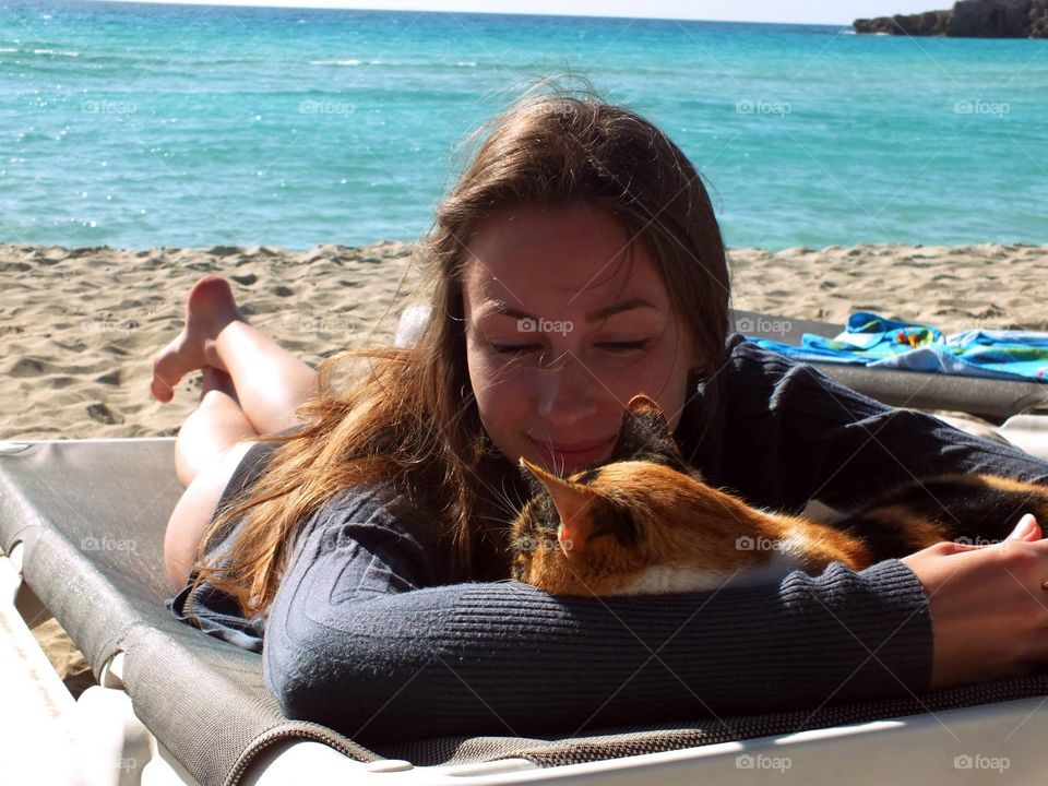 Girl in a Beach with a Cat