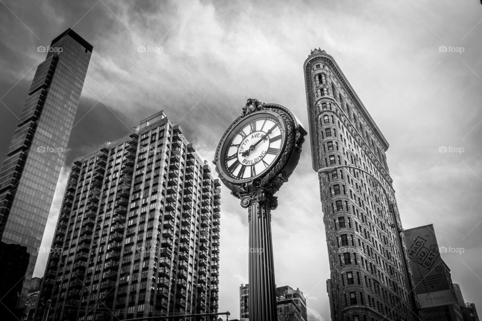 New York clock. black and white of the famous flat iron building in New York