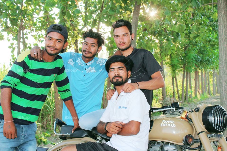Best hobby.. photography with 4king friend with royal Enfield at outdoors under shade of Nature.