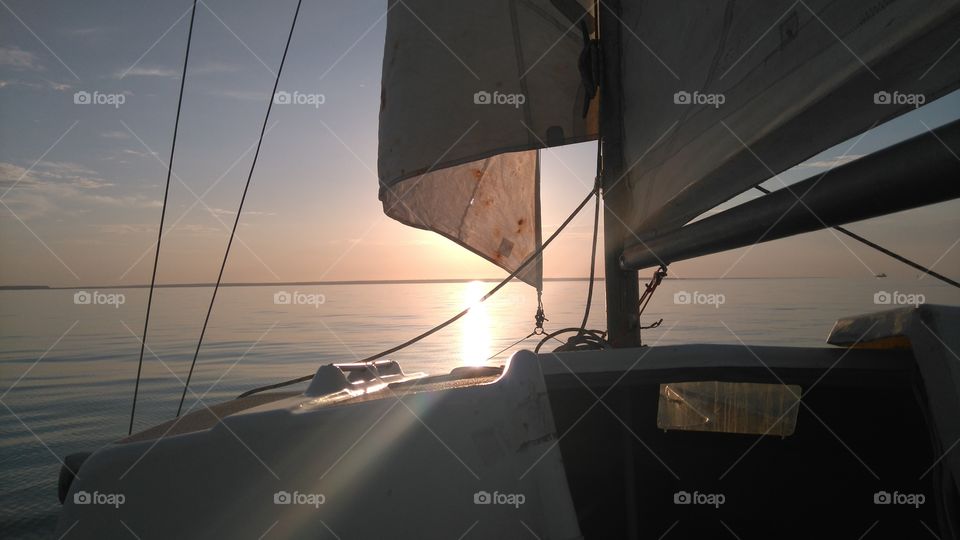 Sunset at sea. sailing at sunset, turned to the open water