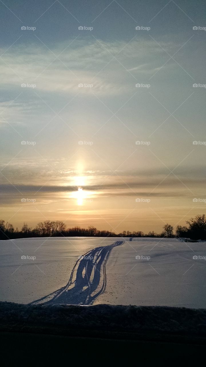 winter solstice. frozen field sunset