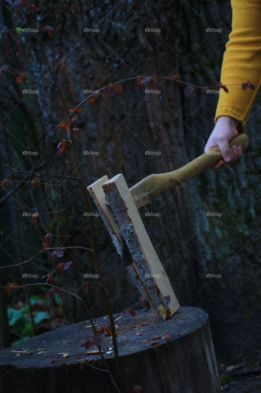 Ax.  Village.  Chop wood.  Country life.  Man's hands.