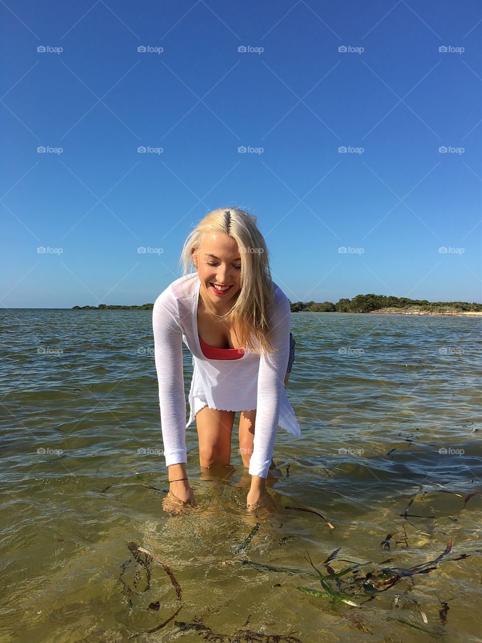 Blonde woman enjoying in sea