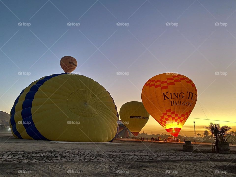 A far away hot air balloon looks like as if is on the other one