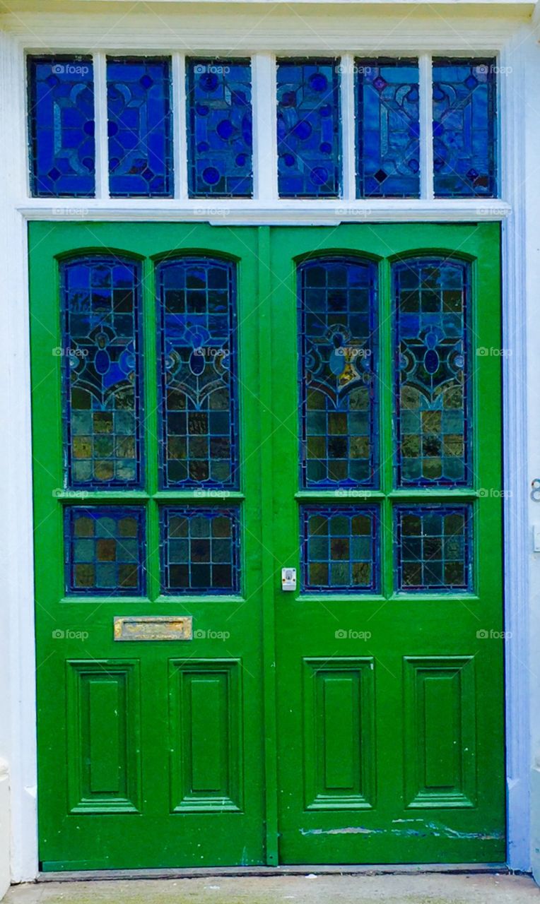green door with stained glass 