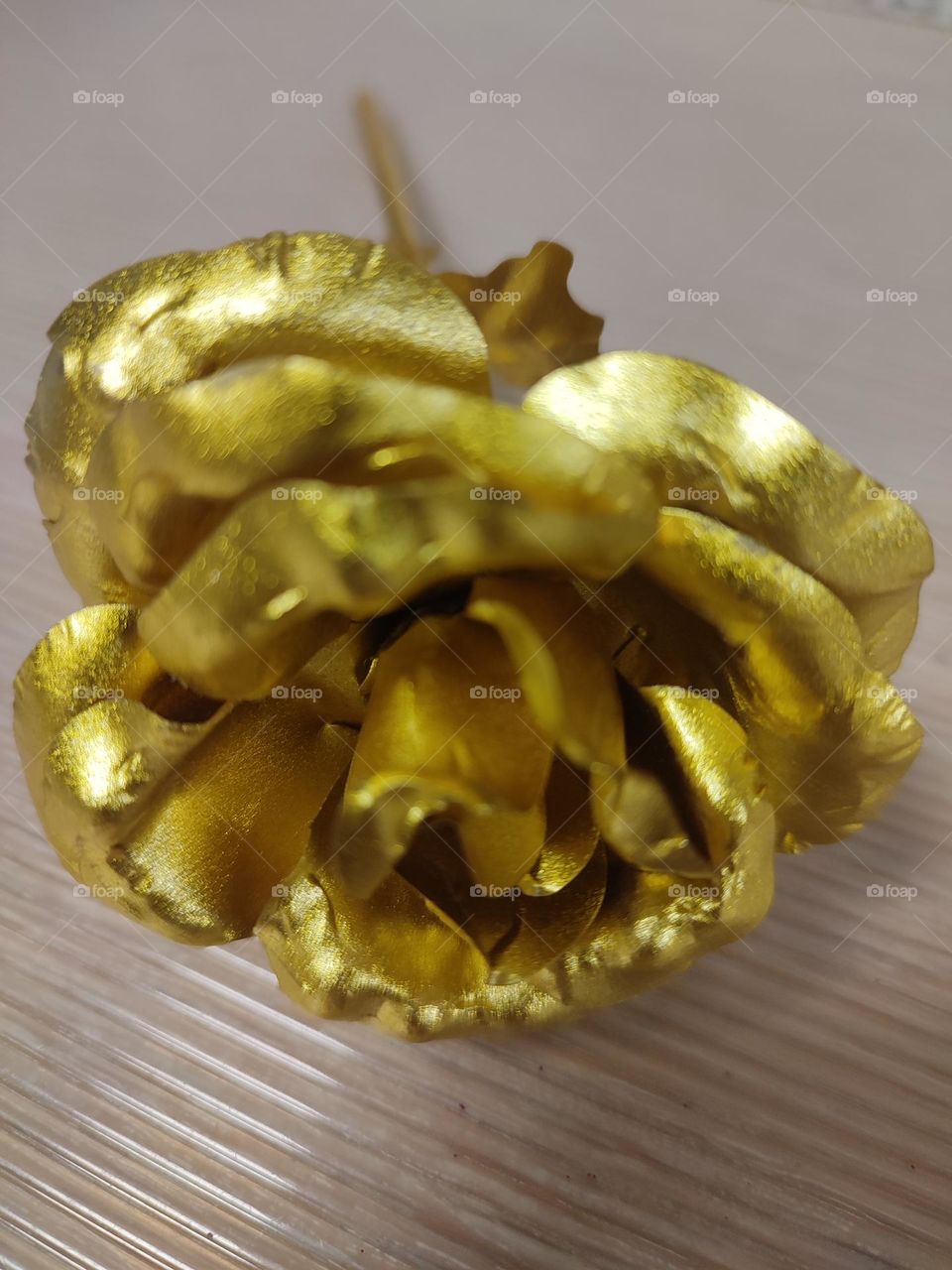 Flower, a rose , gold