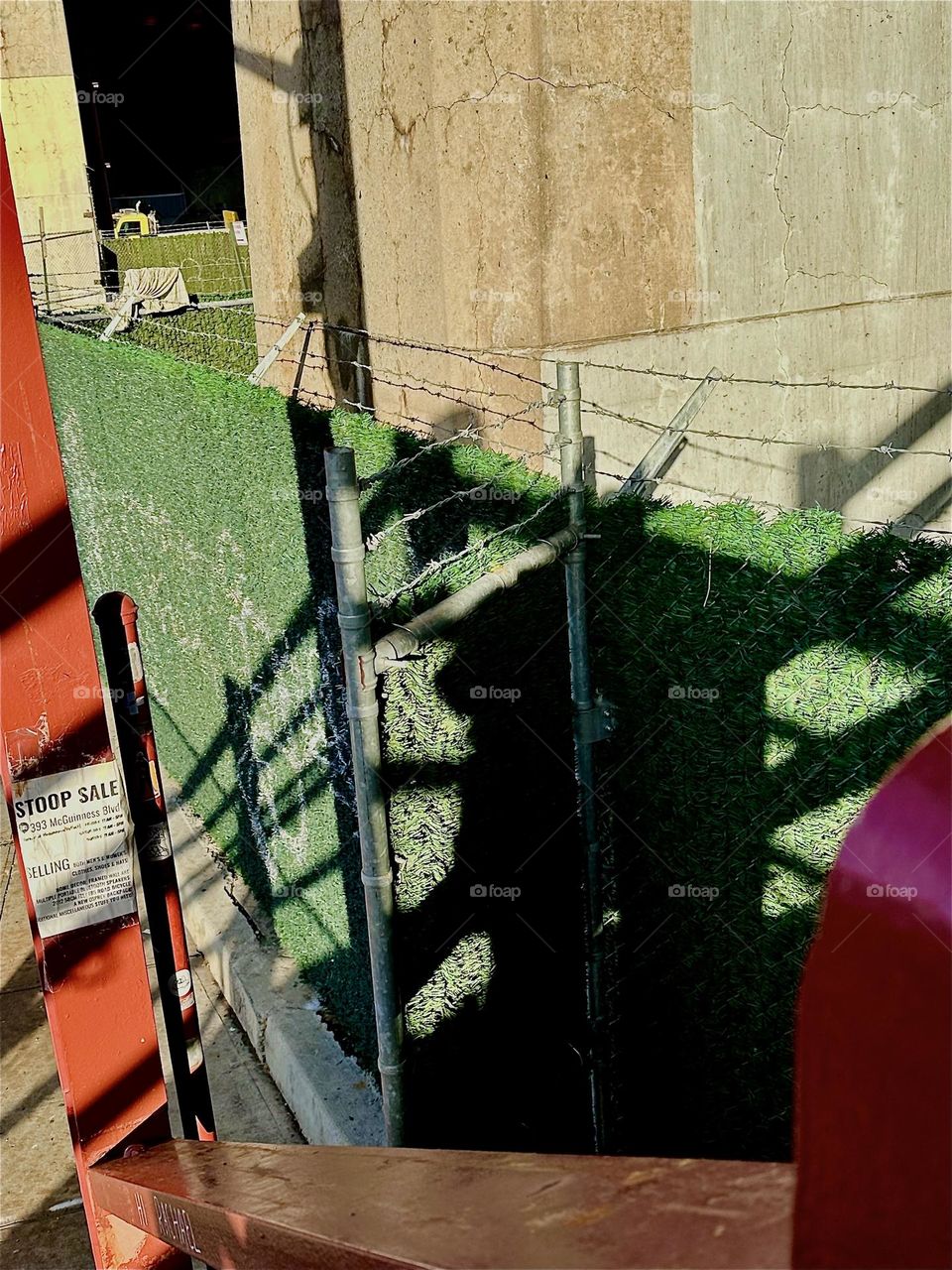 This intricate shadow play forms when looking at the street and the green construction wall below from the staircase of the “Pulaski Bridge” at “Newtown Creek” on the “Greenpoint”, Brooklyn side. 2023. Hypnotic Productions