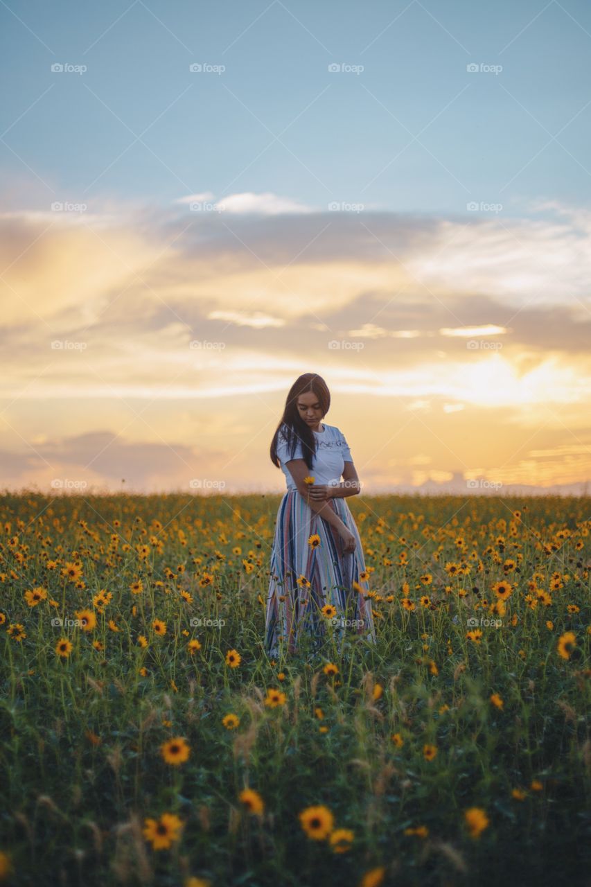 Enjoying summer in a sunflower field 