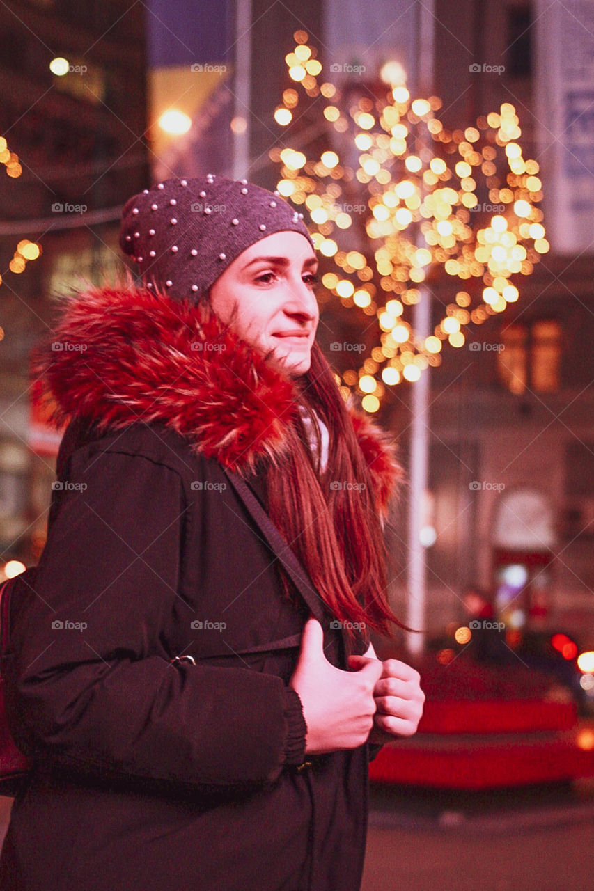 A young lady walking down the streets of Sarajevo