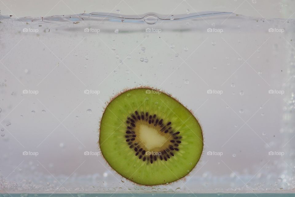 Fresh kiwi in the water 