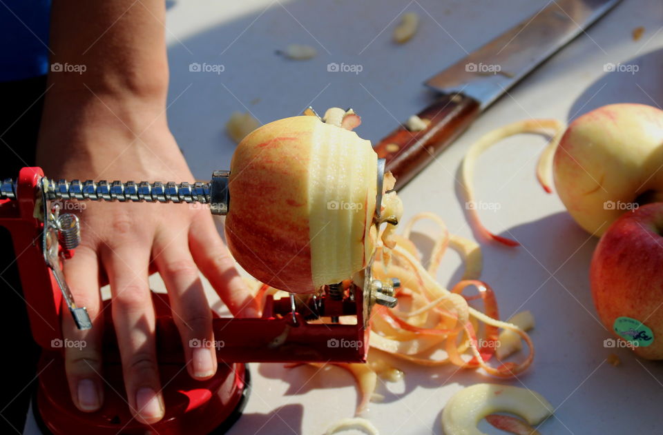 Peeling apple machine, autumn market.