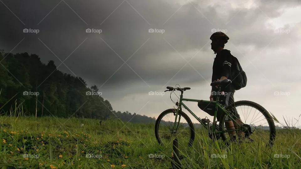 man riding bicycle in outdoor