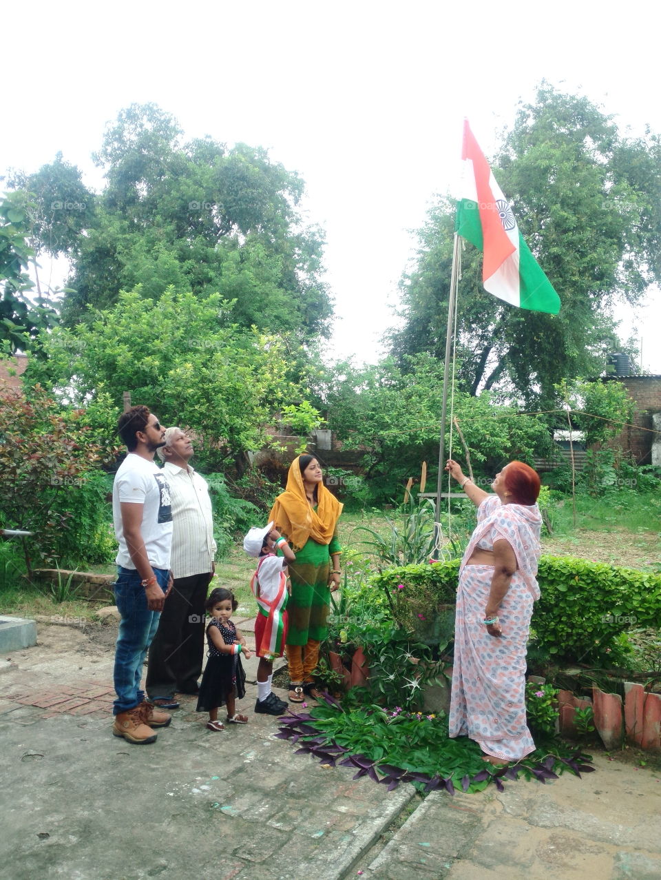indian family celebrating independence day, indian family celebrating republic day, 26 january, 15 August, tiranga, tricolour