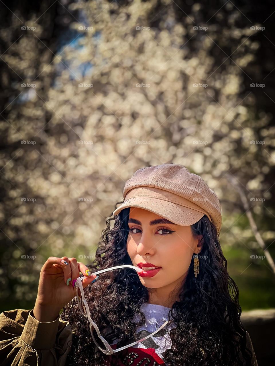 Girl with curly hair and spring flowers