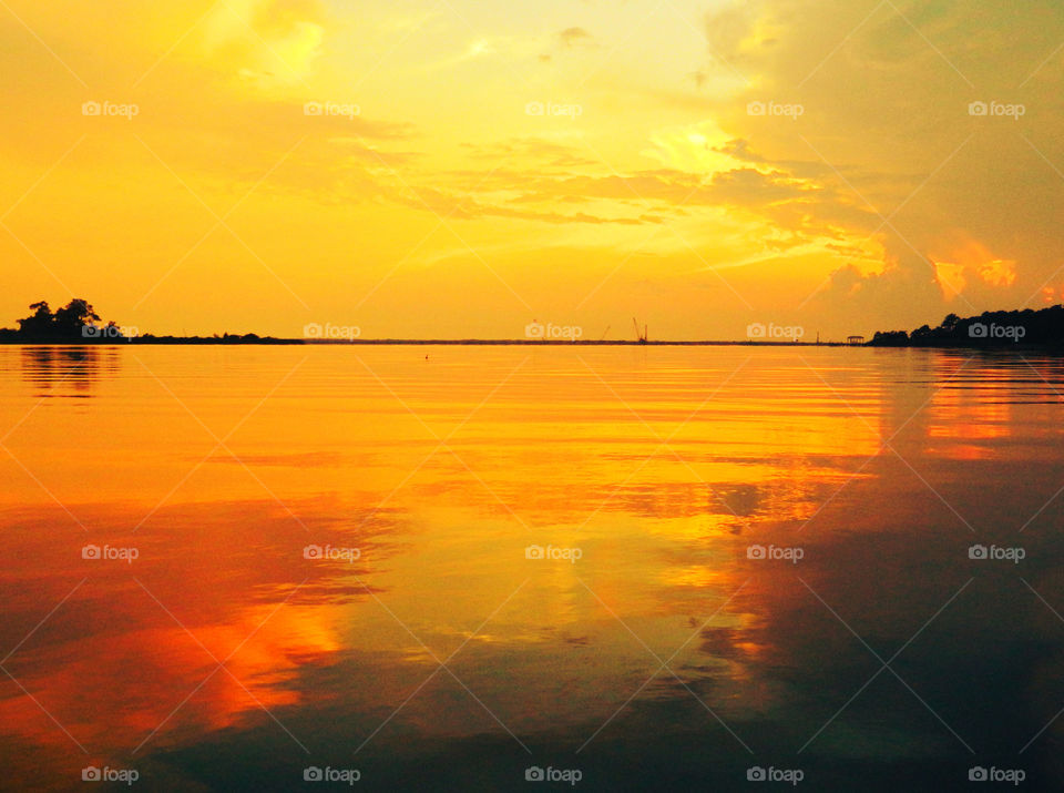 Dramatic clouds reflecting on lake