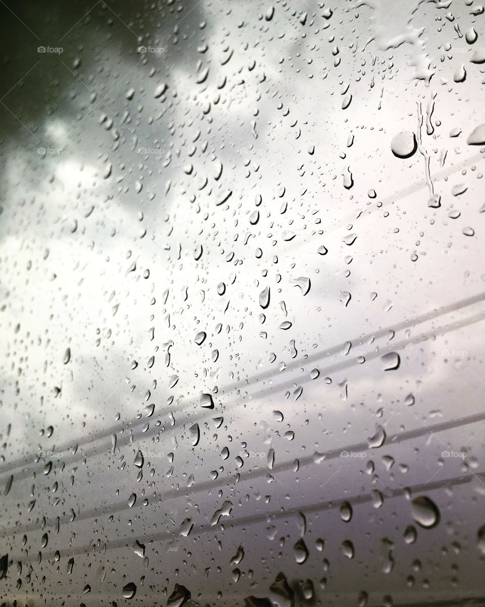 Raindrops racing on a window 