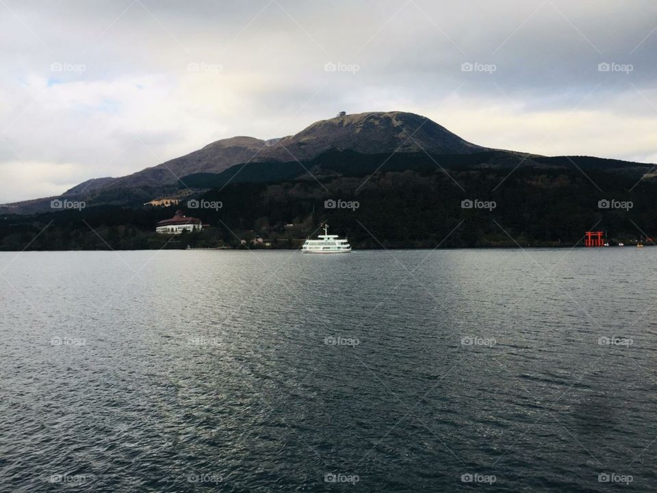 the ship seen in the far of the ocean