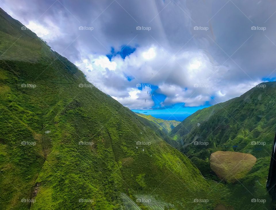 Hawaii from an Ariel view. Breathtaking, lush green rainforests to tranquil and gorgeous ocean views.