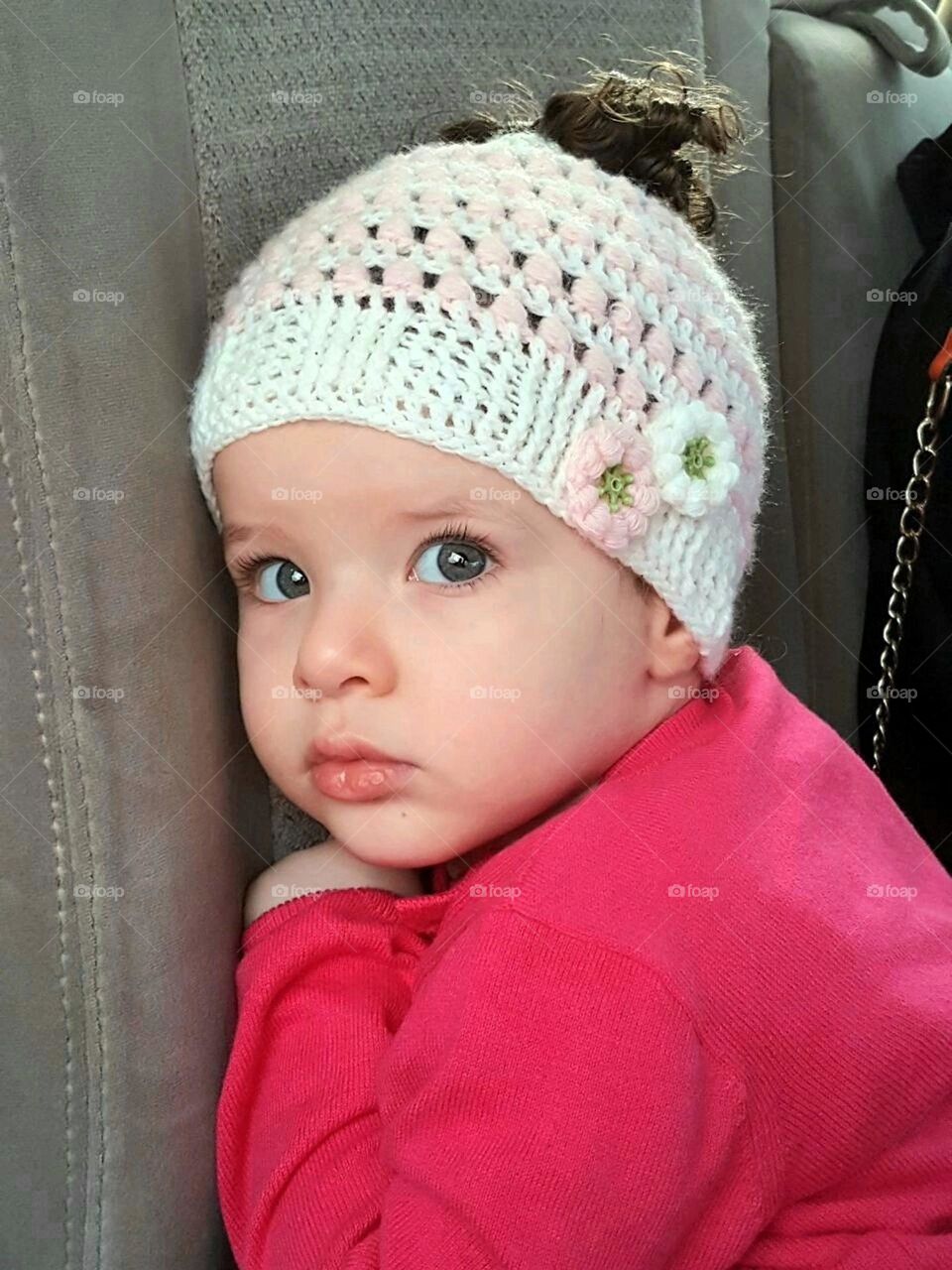 Little girl wearing viva magenta blouse