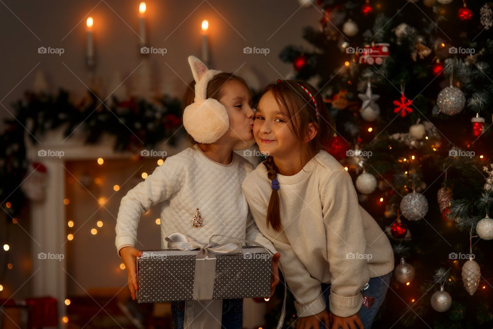 Cute little Sisters at Christmas Eve 