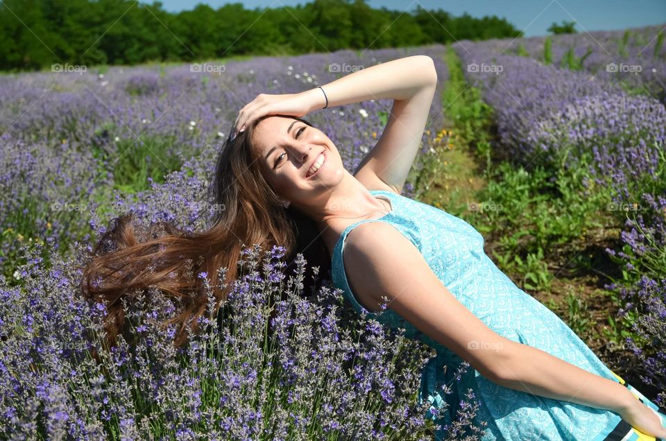 Woman with beautiful natural hair on lavender fields