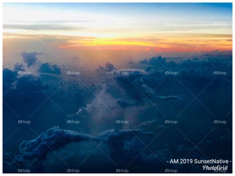 Sunset In The Clouds