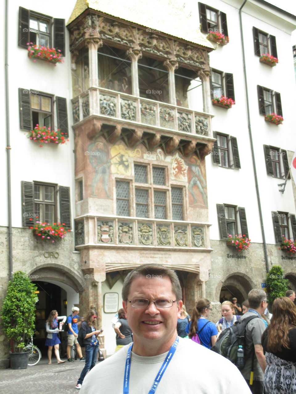 Portrait of a mature man standing in front of building