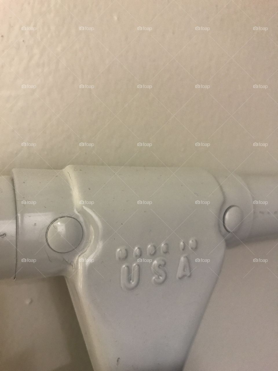 White metal object made in the USA 