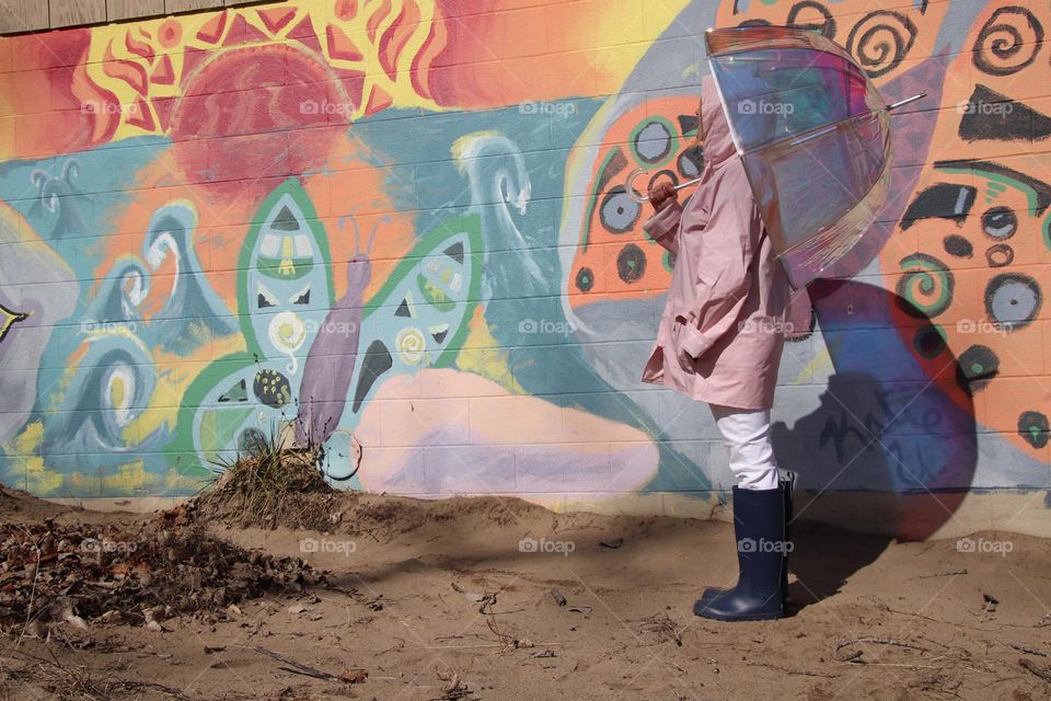 Colorful mural with woman holding umbrella 