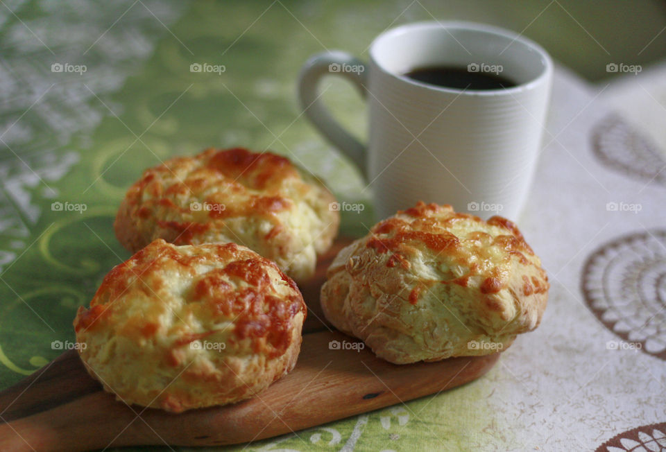 Home made breakfast, bread with cheese and fup of coffee