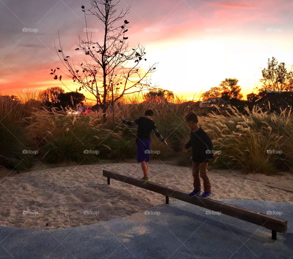 Park play at sunset