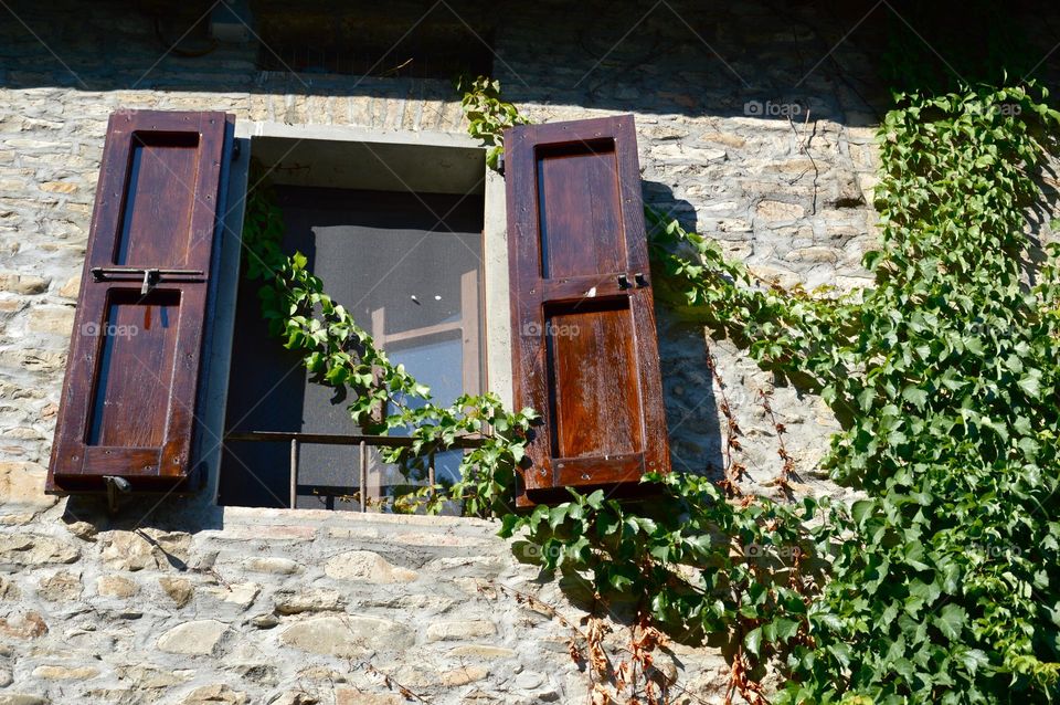 open wooden window in an Italian village