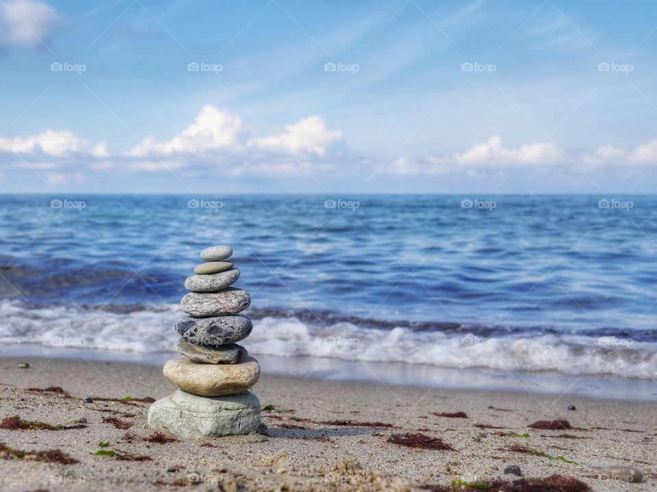 Stacked stones at shoreline