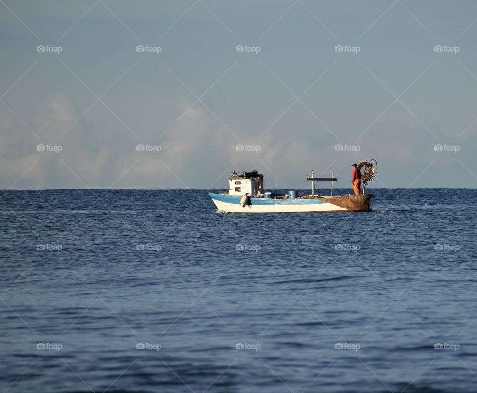 Boat sailing on a calm sea 