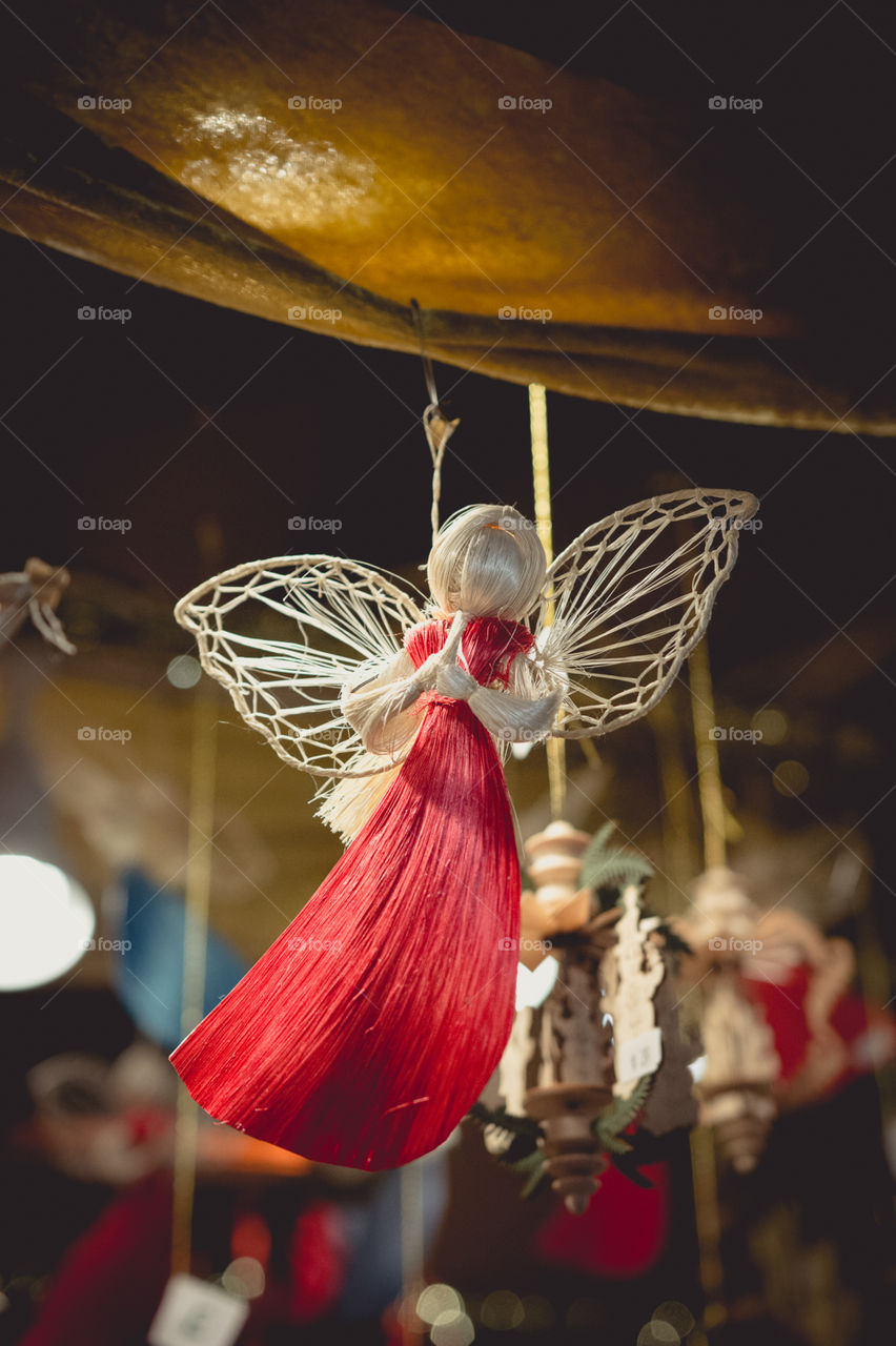 Rustic hanging angel decoration at a Christmas market