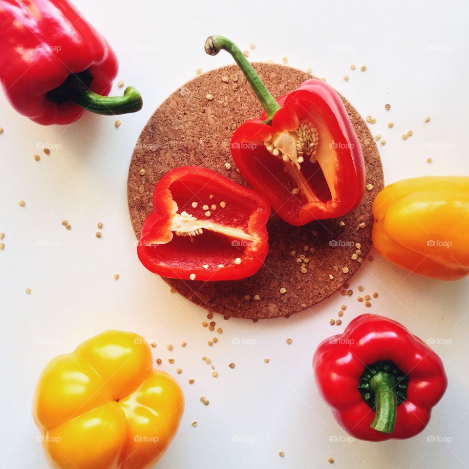 Red and yellow bell peppers .