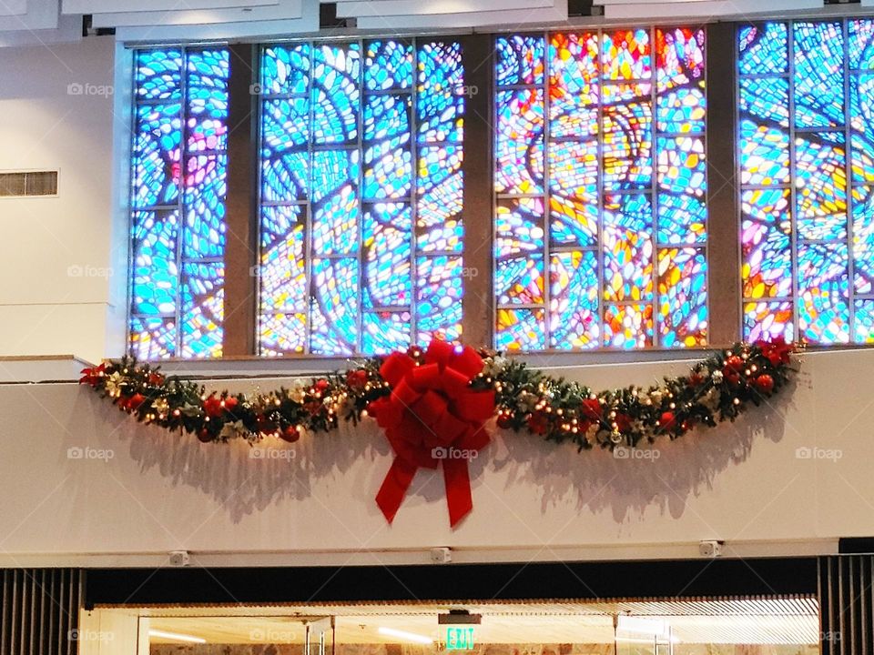 Christmas wreath and garland stained glass at church